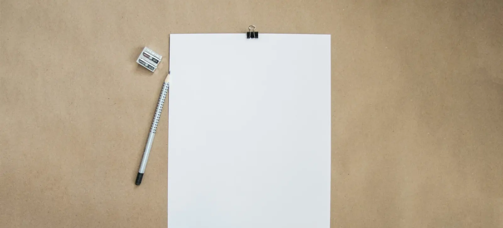 Blank paper and pencil on a desk