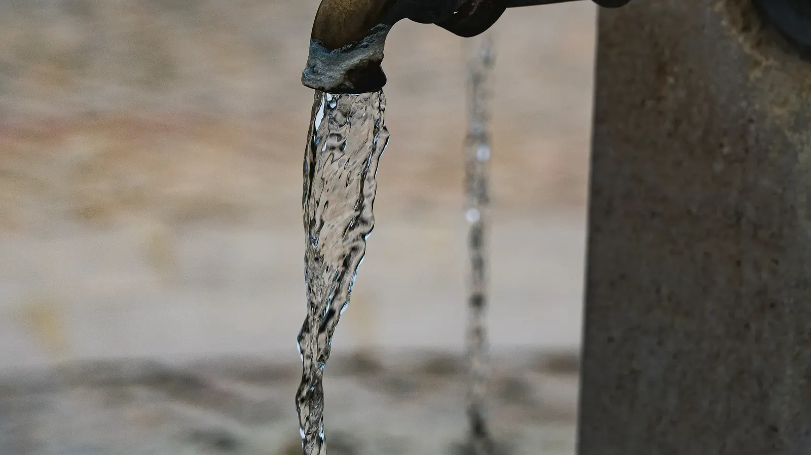 Water flowing from an outdoor spigot