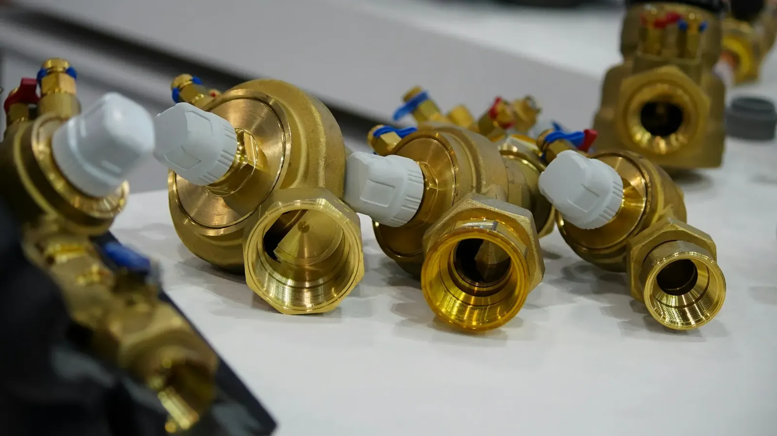 Brass plumbing fittings on a workbench