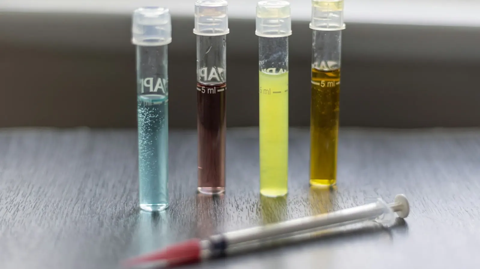 Colored water samples in test vials